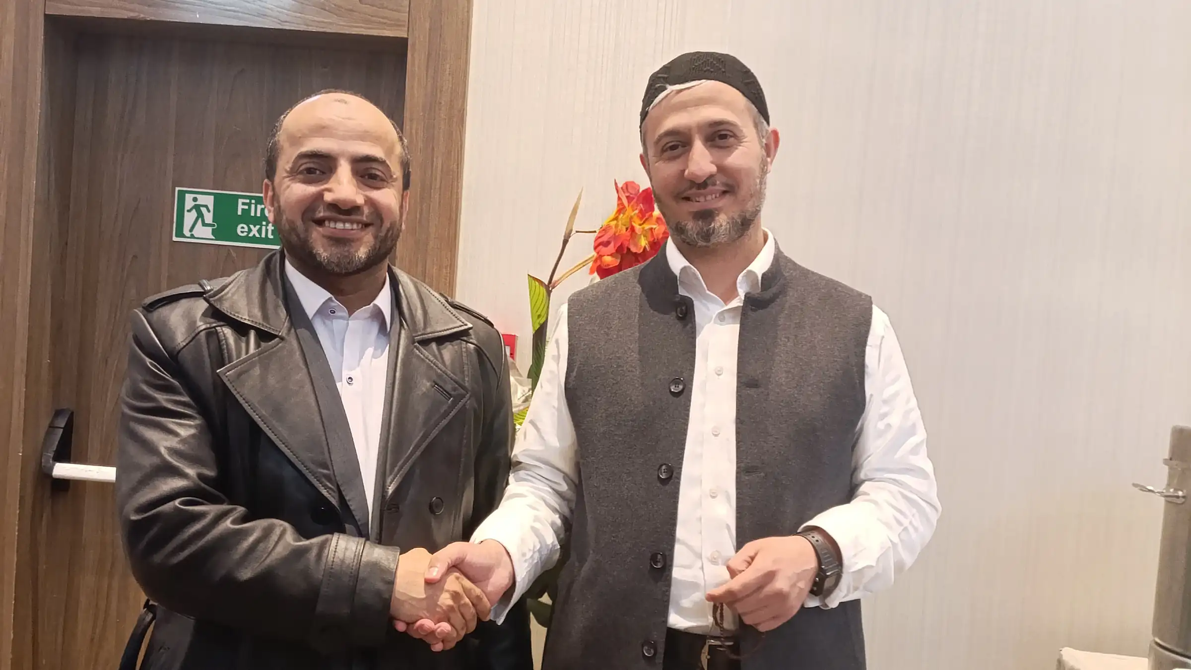 Two partners shaking hands after a meeting